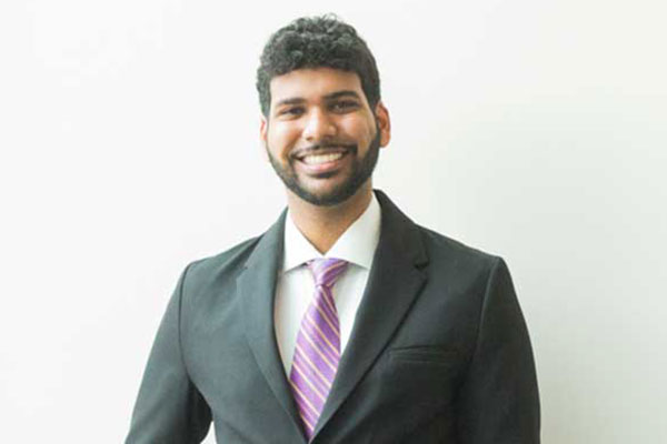 male smiling with suit on