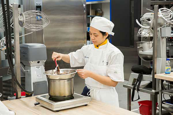 student stirring Chocolate