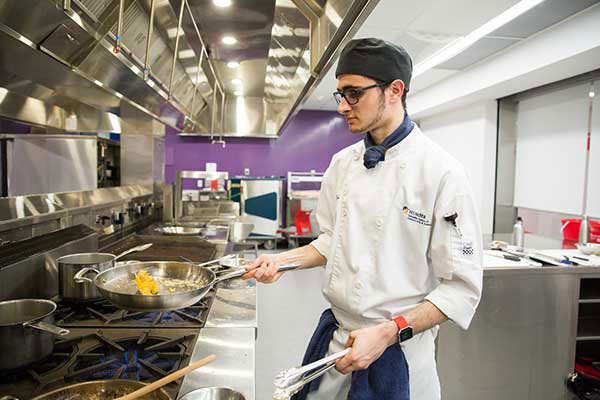 student cooking in the lab