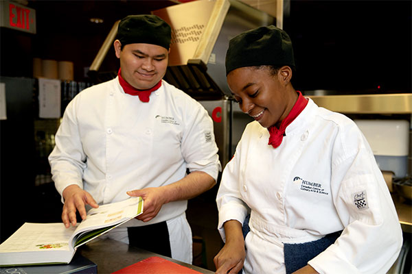 Students cooking in kitchen