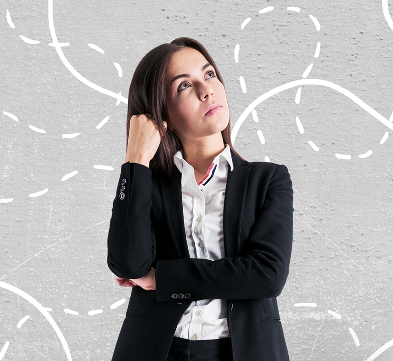 Person standing holding their hand to their head