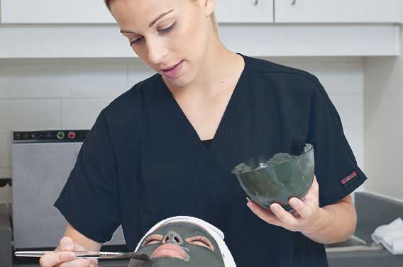 Person applying face mask to client