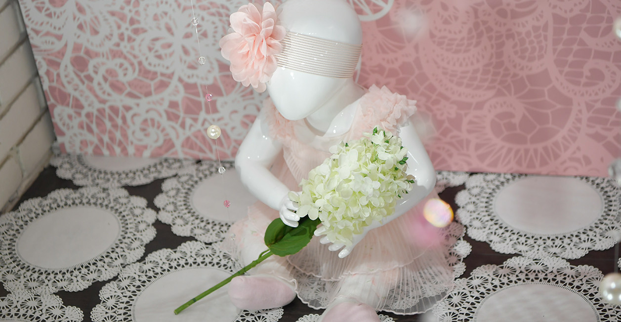 baby mannequin in lace pink dress