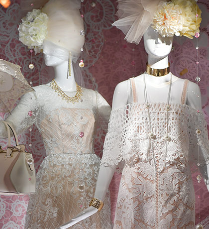 female mannequins in lace dresses