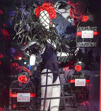 female mannequin with ravens and roses