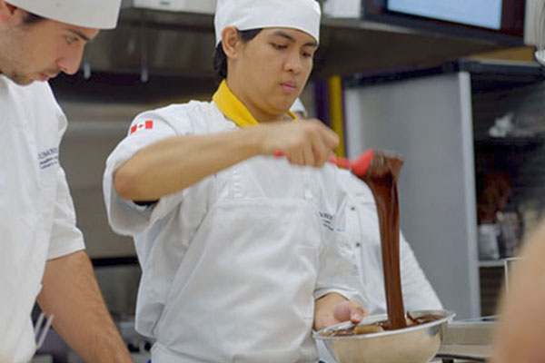 student stirring chocolate