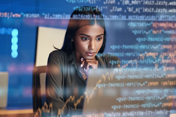 Person looking at computer with code