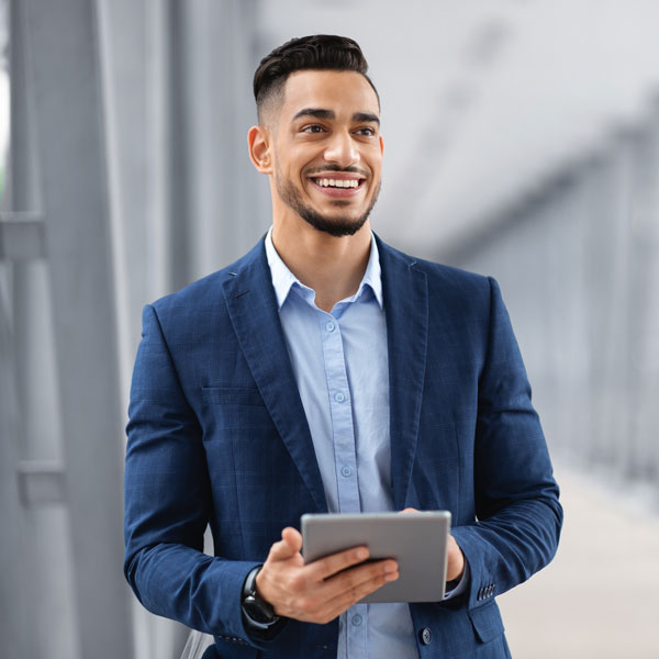 person walking with a tablet