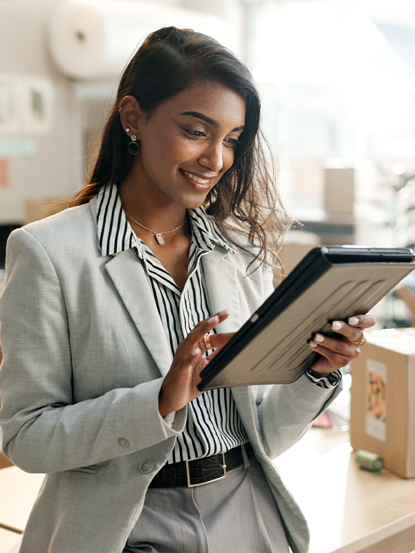 Person smiling looking at tablet