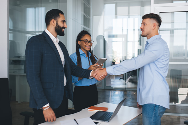 People in a meeting shaking hands
