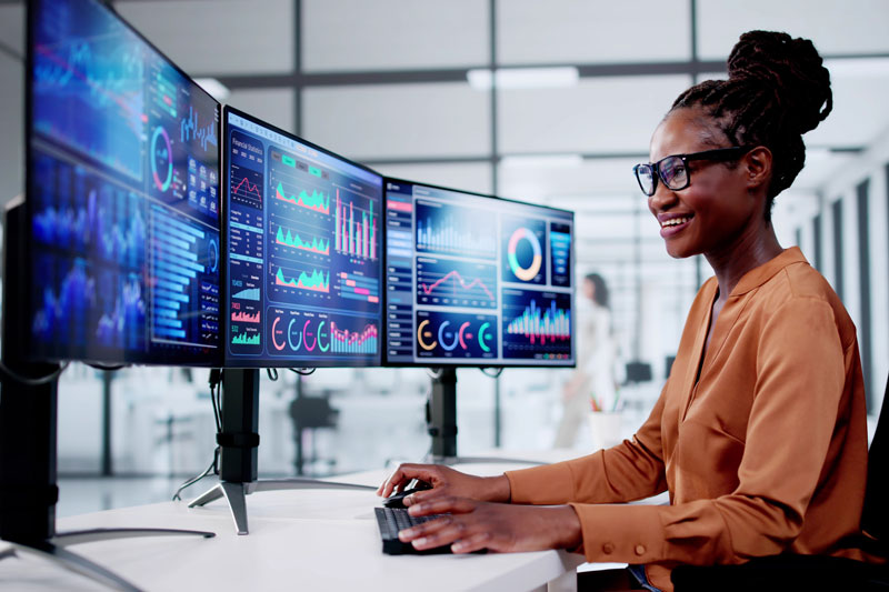 Person smiling working on computer