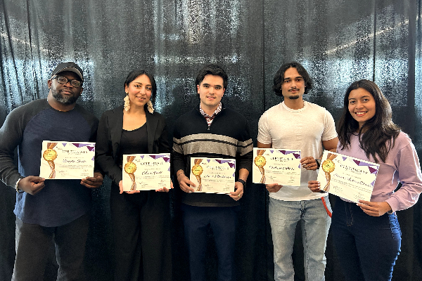 Longo ICE student winners holding up their awards and smiling