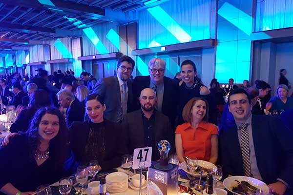 Student and Faculty at their table during the Board of Trade Dinner