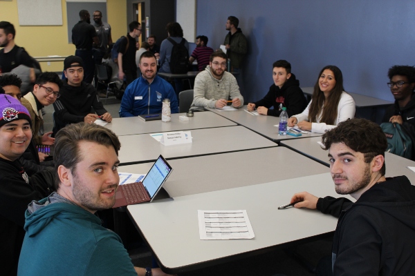 Sport Management students sitting around a table in class