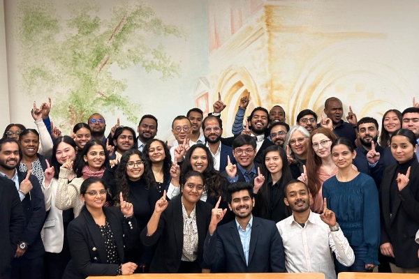 Smiling group of people dressed in business casual attire