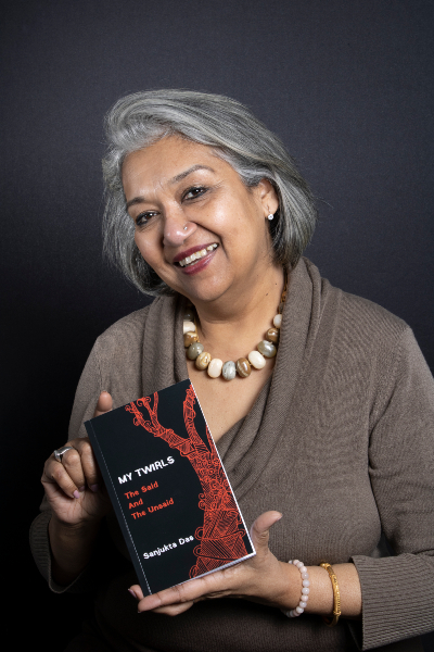 Sanjukta Das posing with her new book