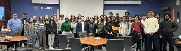 Industry panel taking a group photo with Event Management students