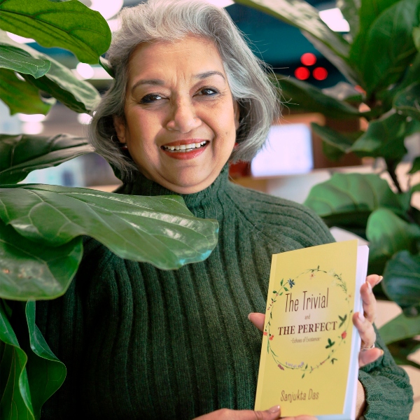 Sanjukta Das posing with her new book