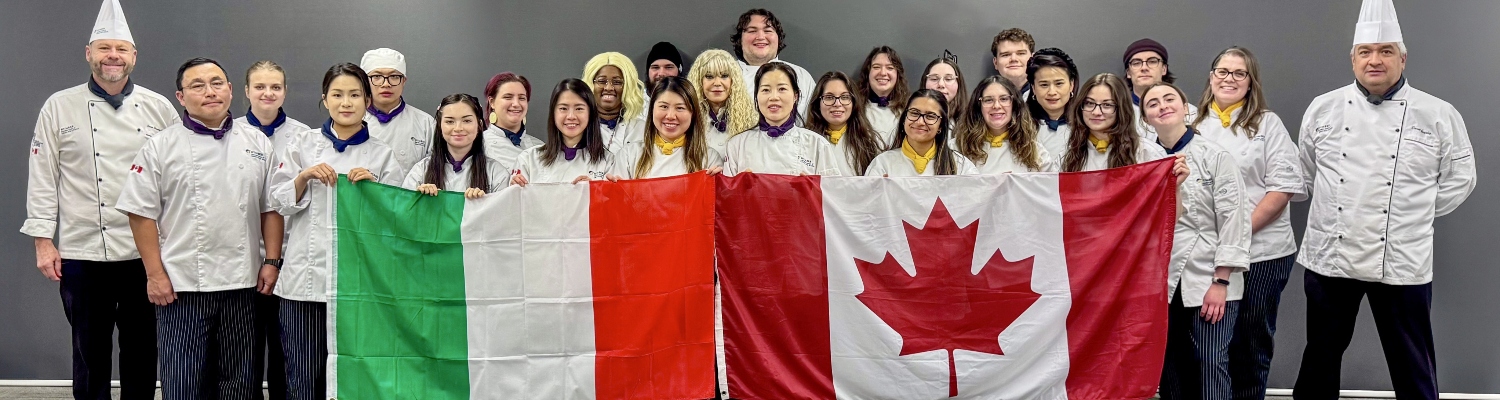 Humber Culinary students holding up an Italian and Canadian flag side by side