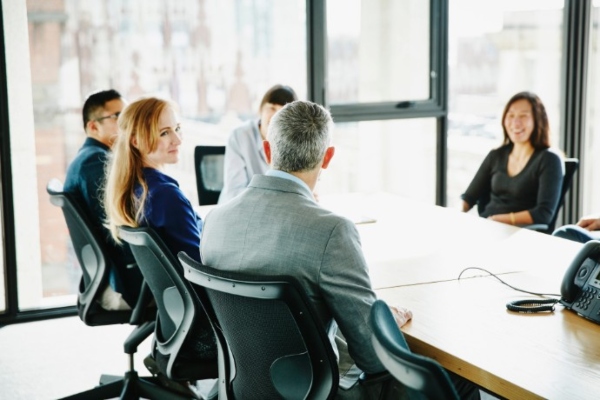 Employees in a board room