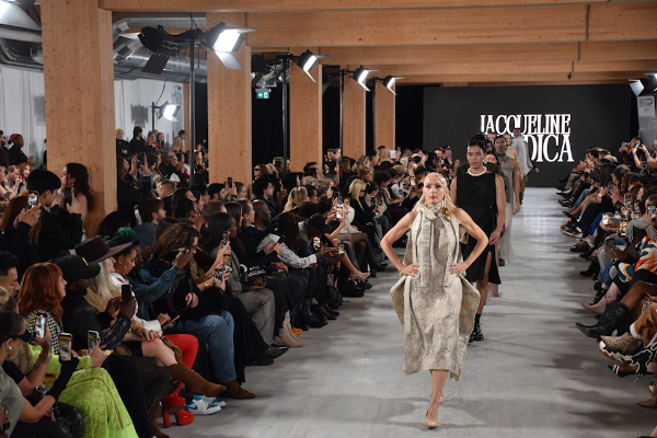 Jacqueline Bradica models walking the catwalk on opening night of Toronto Art Fashion week.