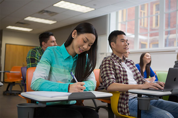 international students writing in class