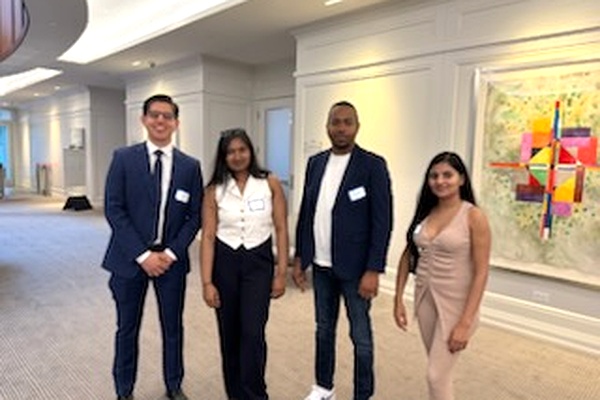 students from the Bachelor of Commerce Finance degree program at a convention center attending the Barometer Capital's Cocktail Mixer