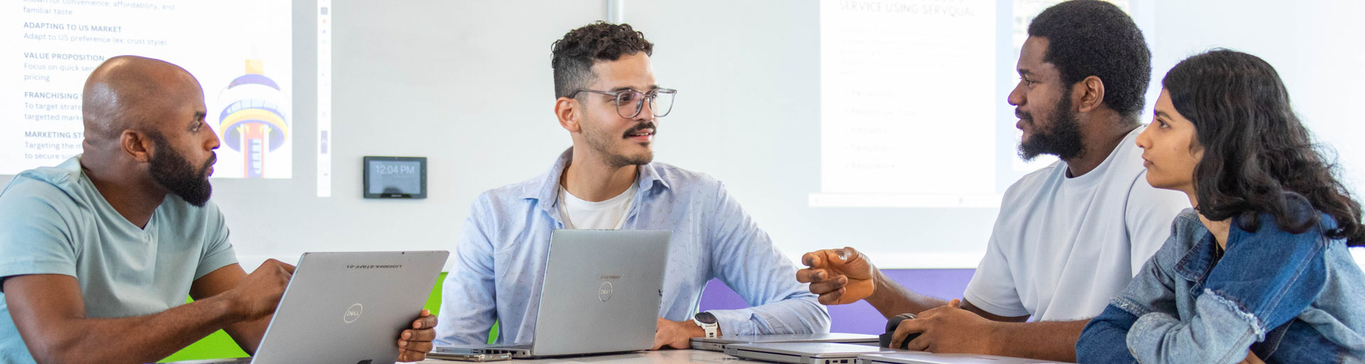 Four people working together on project