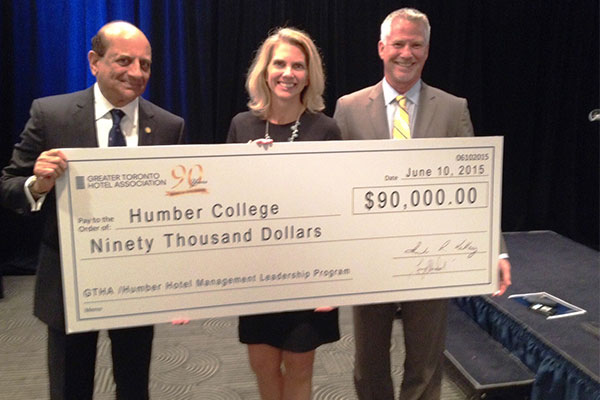 people holding a cheque