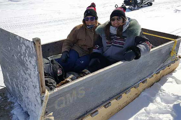Two students in a sled