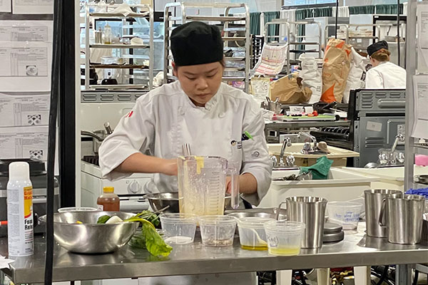 student cooking in a classroom