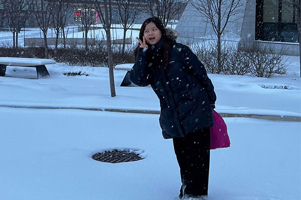 person taking a photo in the snow