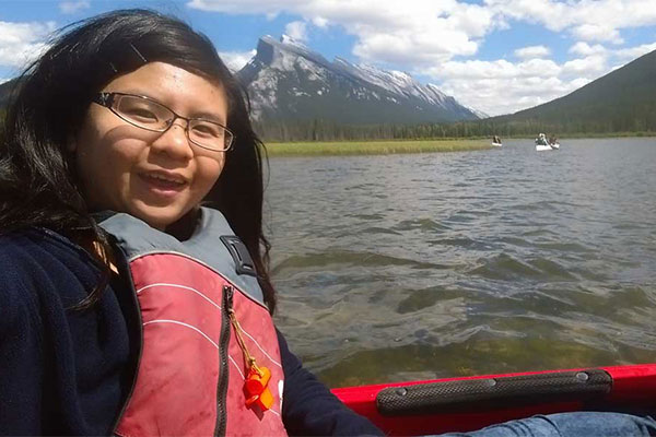 female sitting in kayak