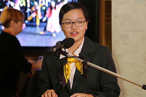 female speaker at podium