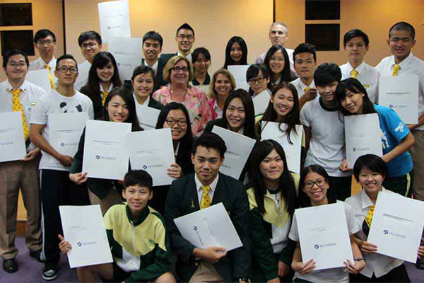 group of students holding certificates