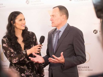 President Chris Whitaker being interviewed at fashion show