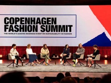 panel of people sitting on stage at the Copenhagen fashion summit