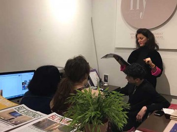 students working in front of a computer in an office