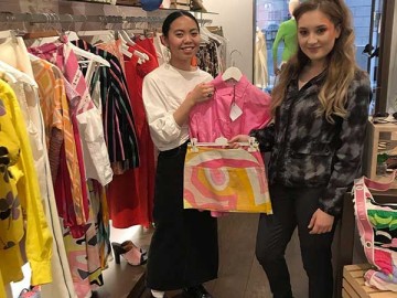 two female students in retail outlet