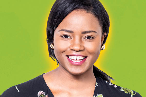 smiling student on green background