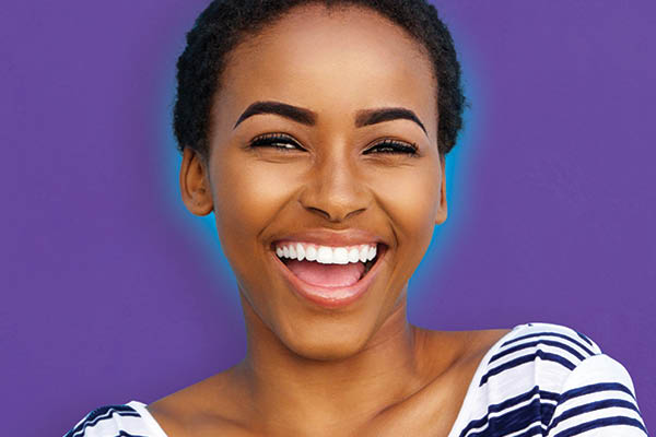 smiling student on purple background
