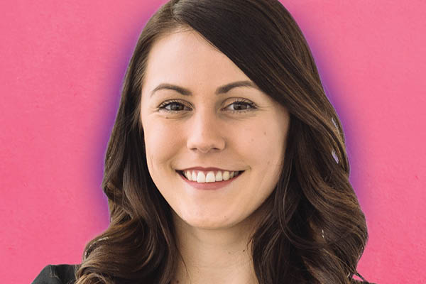smiling student on pink background