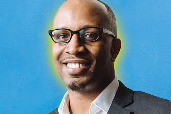 smiling student on blue background