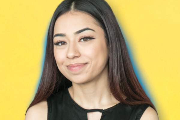 smiling student on yellow background