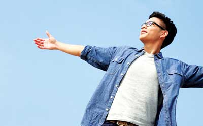 Student with arms stretched out