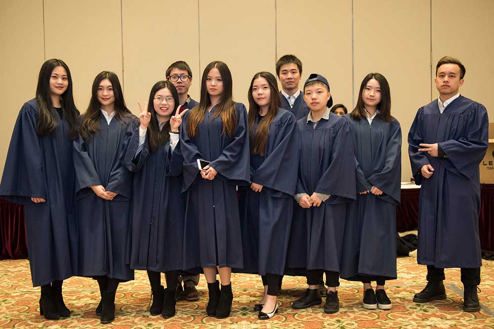 Graduating students smiling