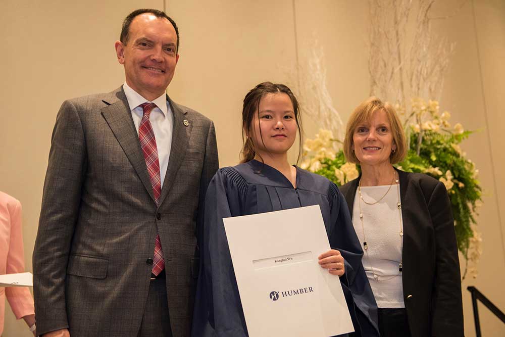 Dean with graduates