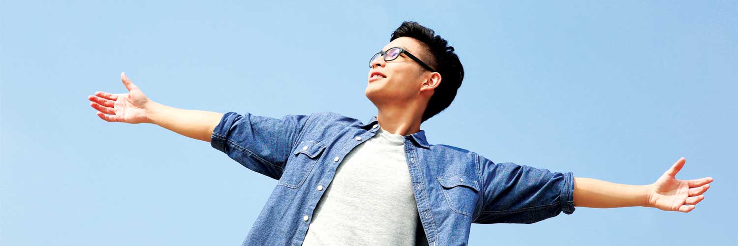 Student with arms stretched out