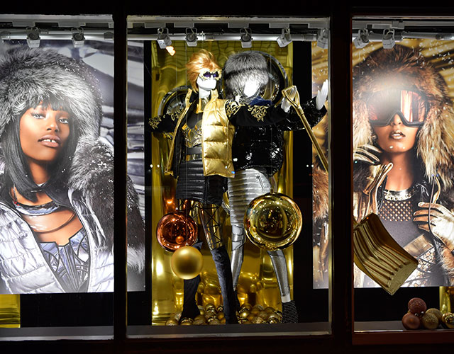 female mannequins dressed in silver and gold
