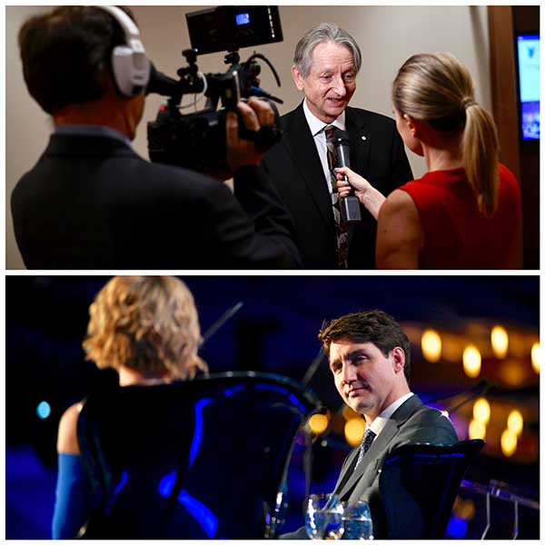 Justin Trudeau speaking with a woman  